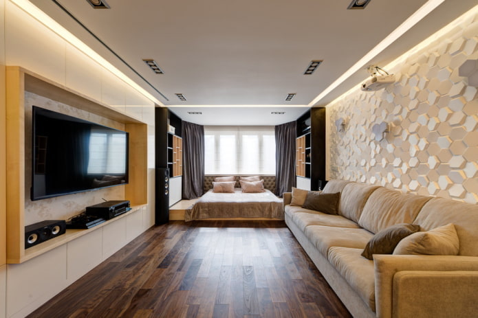bed in the living room in the bay window