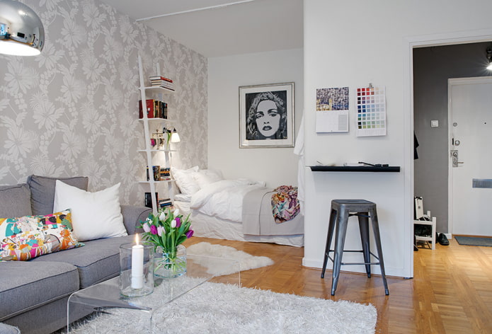 niche with a bed in a one-room apartment