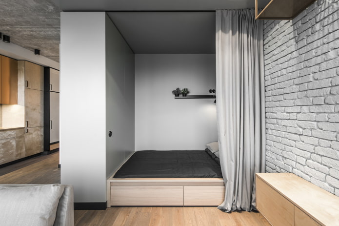 niche with a bed in a loft-style interior