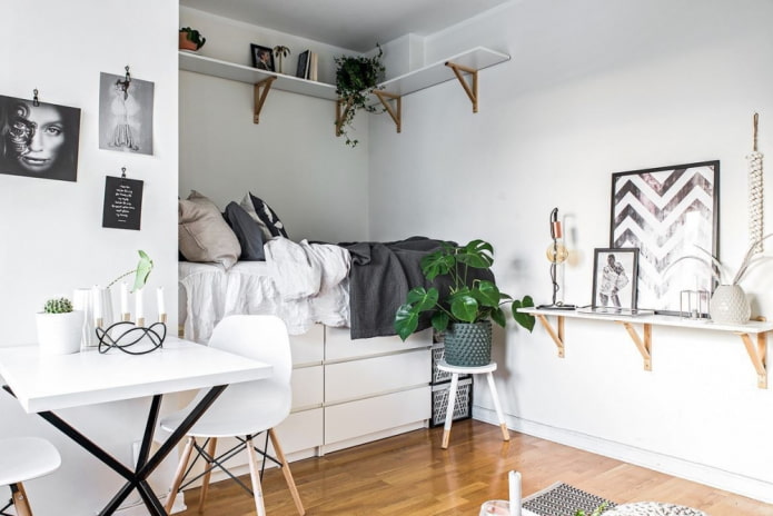 niche with a bed in the interior in Scandinavian style