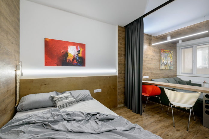 bed and sofa in a one-room apartment