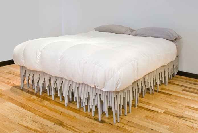 bed made of plastic pipes in the bedroom interior