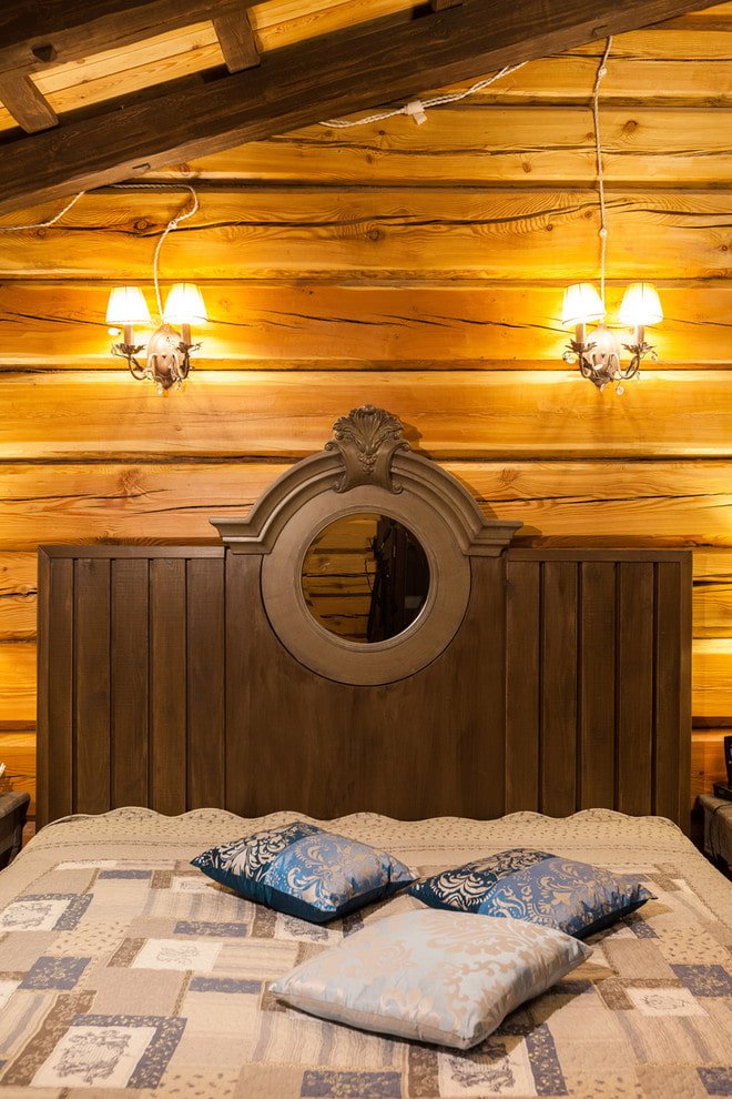 wooden bed with carved headboards in the interior