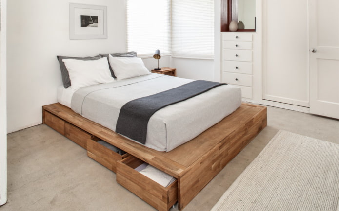 wooden bed with drawers in the interior