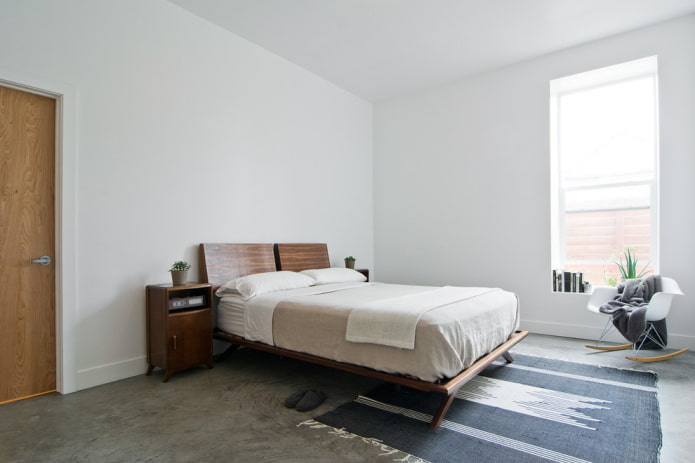 wooden bed in the bedroom