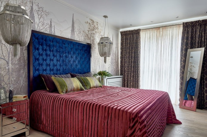 bed with a velor headboard in the interior