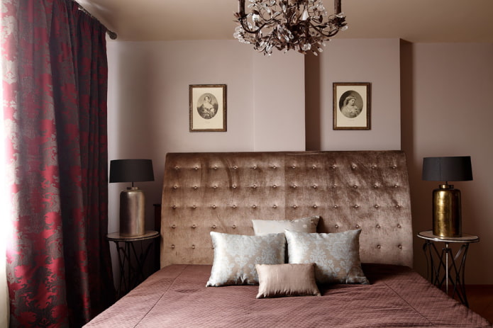 bed with velvet headboard in the interior