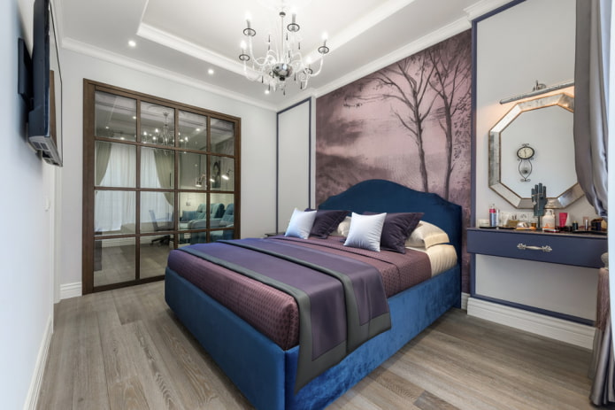 bed with blue headboard in the interior