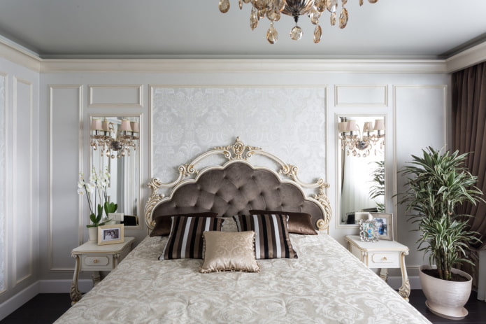 bed with a figured headboard in the interior