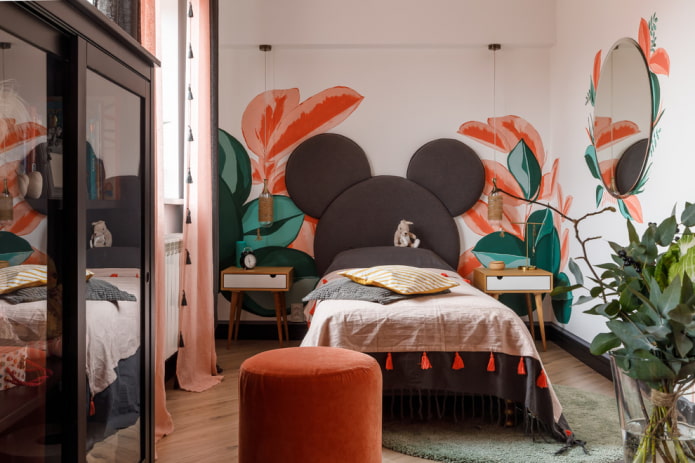 bed with a soft headboard in a child's room