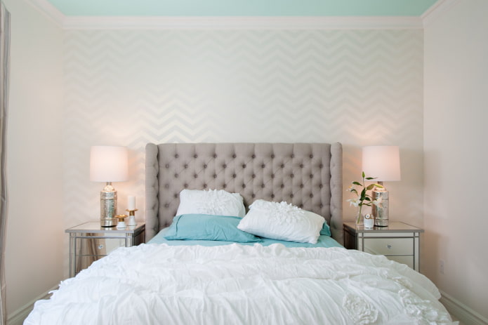 bed with a rectangular headboard in the interior