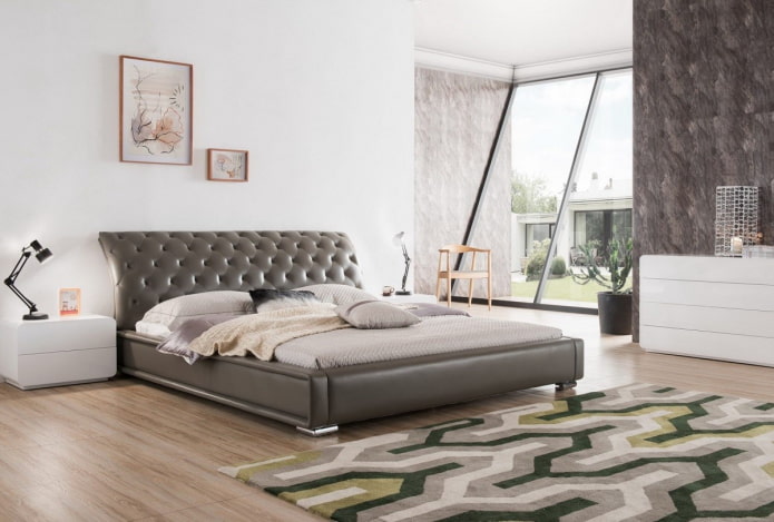 bed with curved headboard in the interior