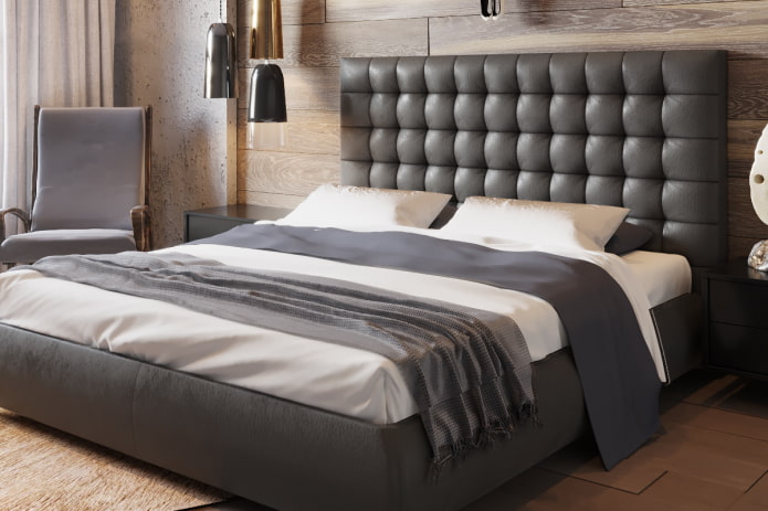 bed with quilted headboard in the interior