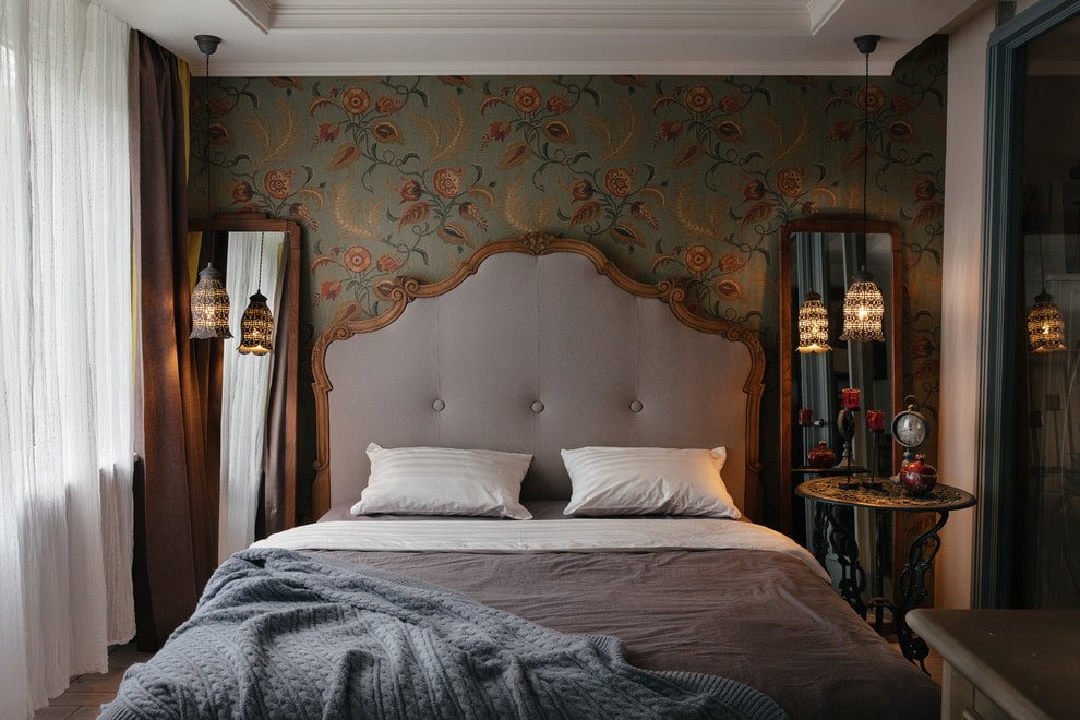 wooden bed with soft headboard in the interior