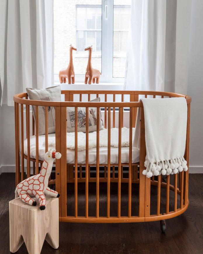oval crib for a baby in the interior