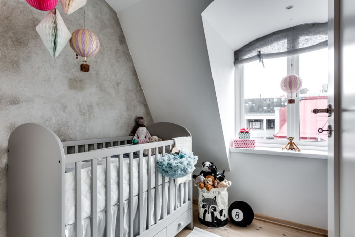 gray crib for a baby in the interior