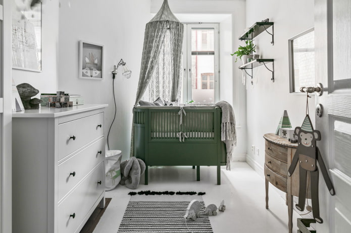 green crib for a baby in the interior