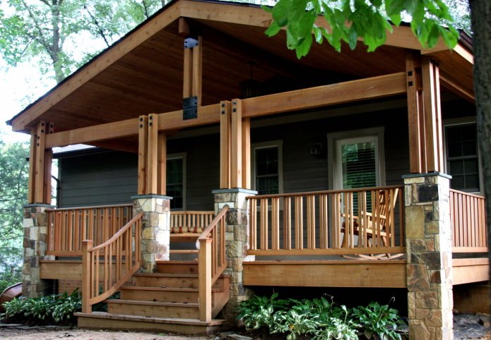 wooden house with a porch-terrace