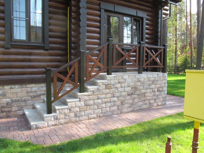 stone porch near a wooden house