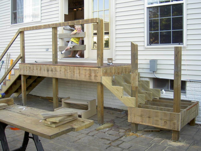 the process of assembling a wooden porch