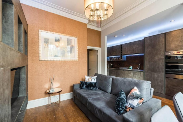 sofa in the interior of the kitchen-living room of 16 square meters