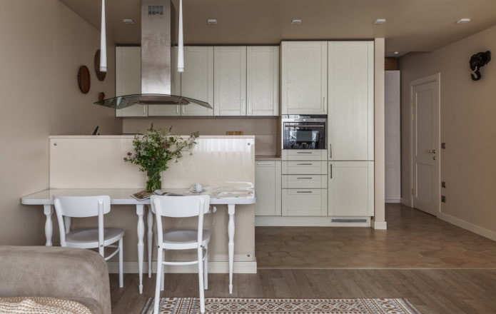 white and wooden kitchen in a niche in the interior