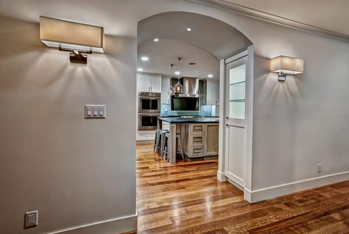 an arch between the kitchen and the hallway