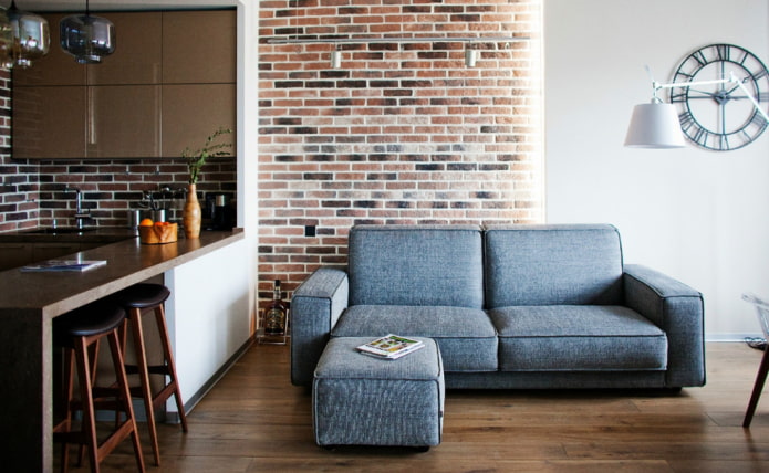 sofa in the kitchen interior in the loft style