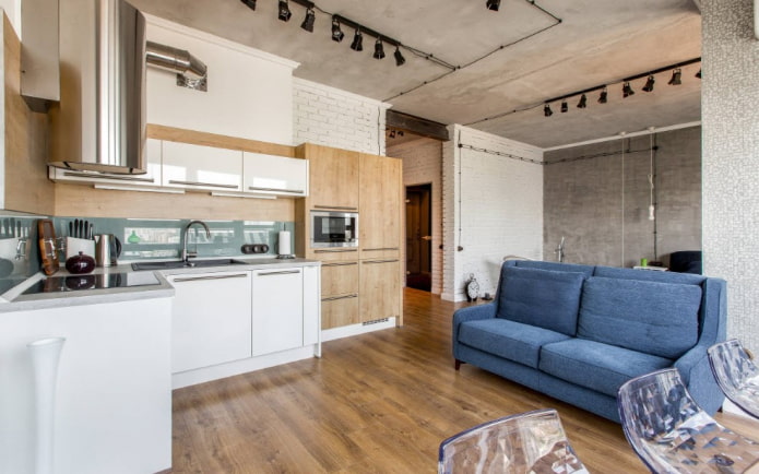 sofa in the kitchen interior in the loft style
