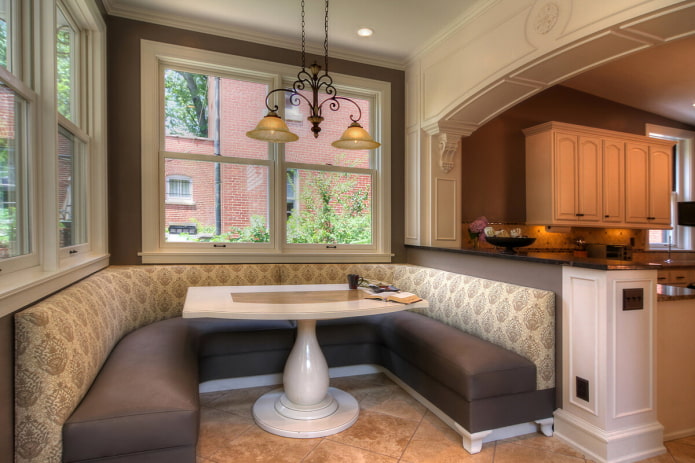 U-shaped sofa in the kitchen interior