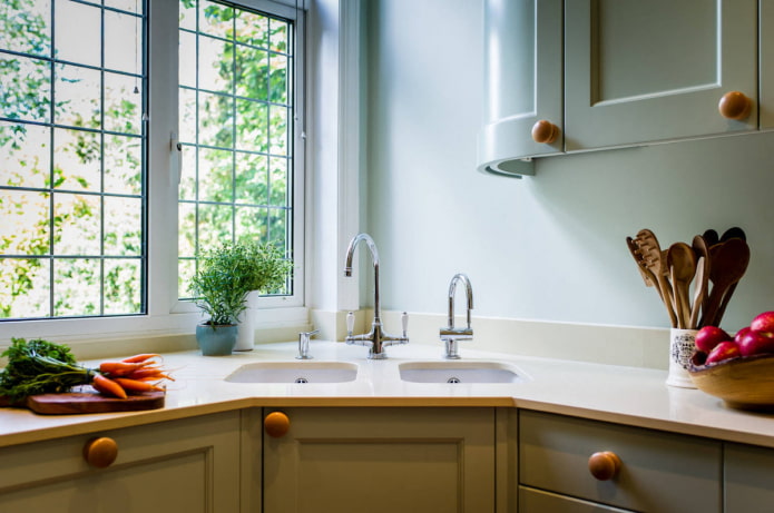 two sinks in the corner of the kitchen