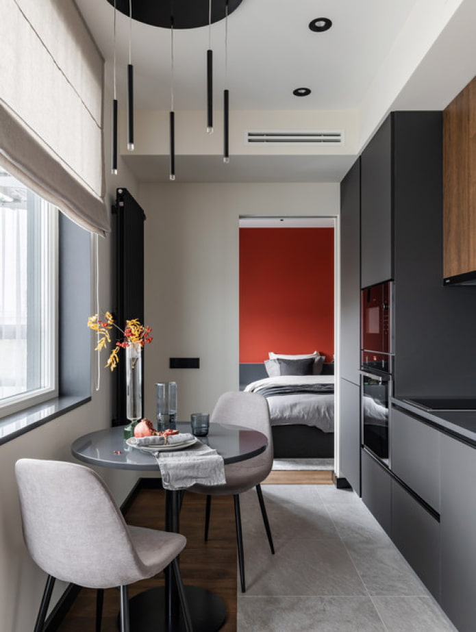 straight kitchen with a window