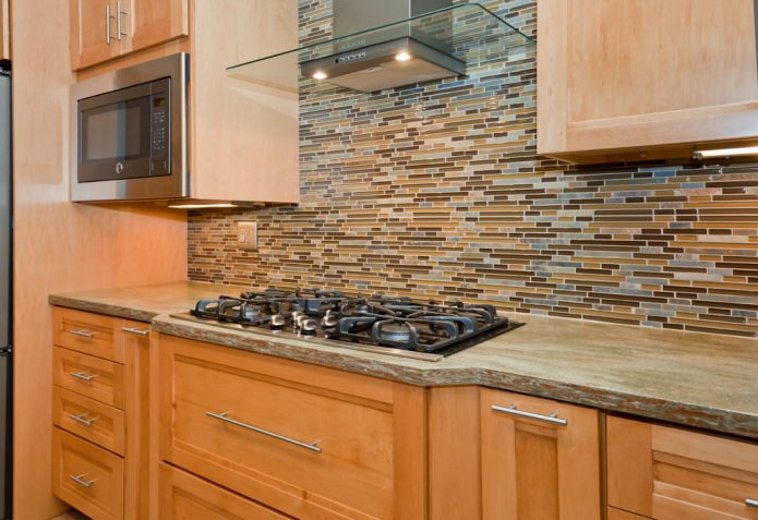 wooden set with a brown-green stone countertop