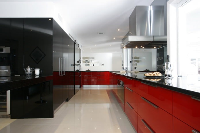 red kitchen set with a black countertop