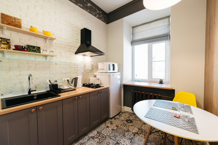 kitchen without upper cabinets with brick-like wallpaper