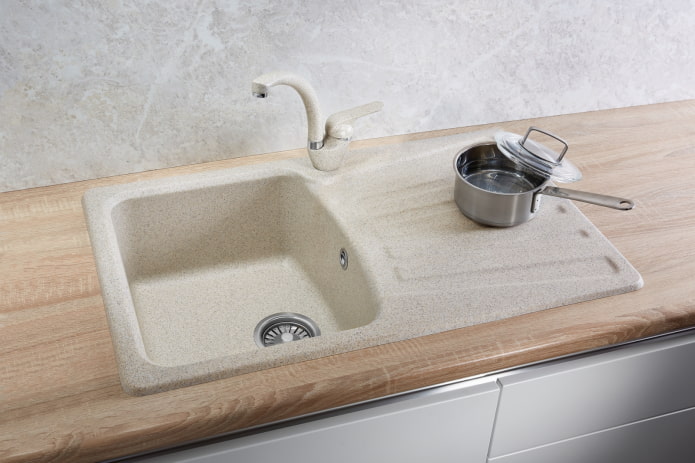 sink with a draining wing made of artificial stone