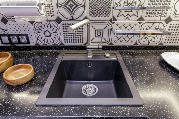 black sink made of artificial stone in the interior