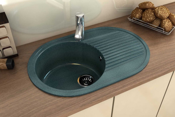 green sink made of artificial stone in the interior