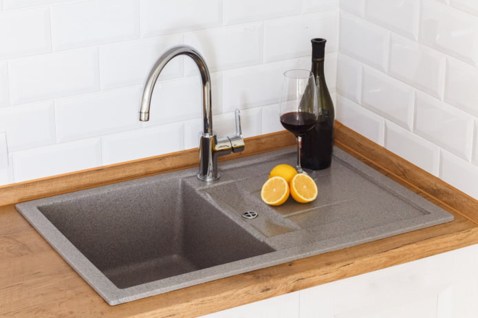 sink with a draining wing made of artificial stone