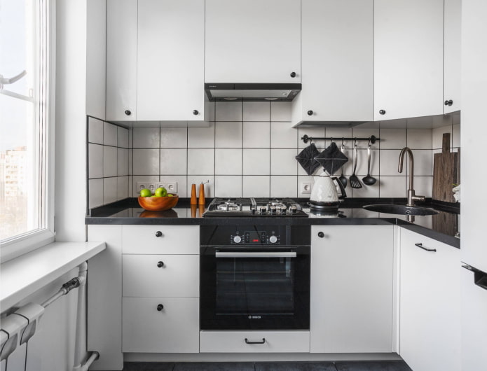 white kitchen with black handles