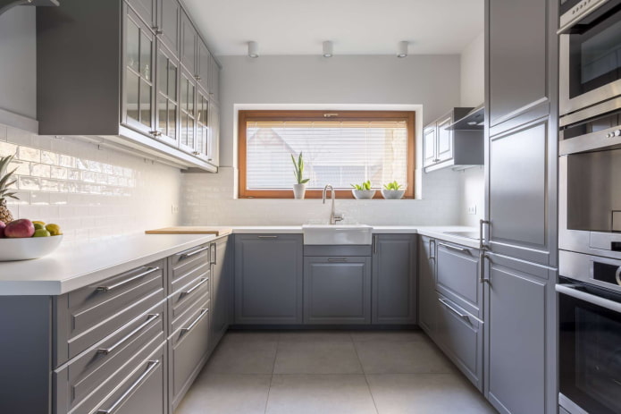gray kitchen in the shape of the letter U