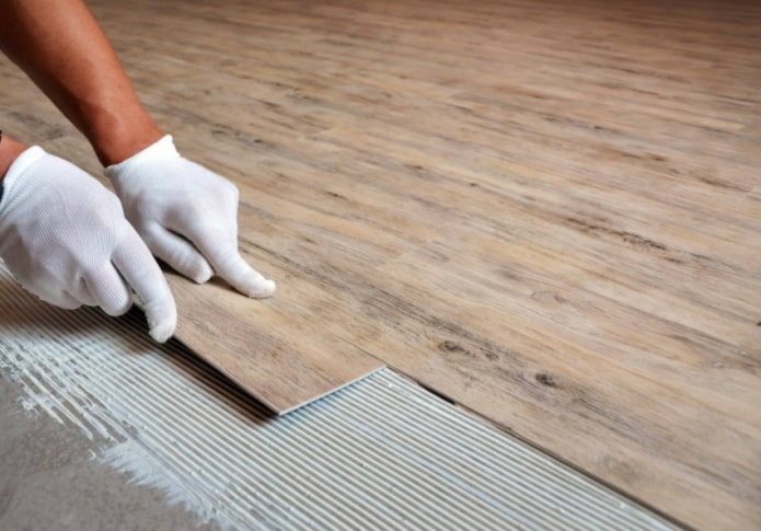 Adhesive quartz vinyl tile