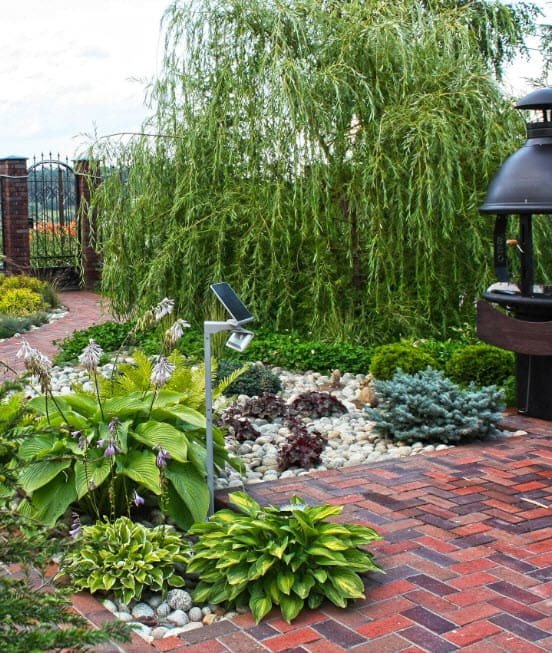 decorating a flower bed with stones