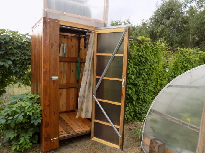 summer wooden shower at the dacha