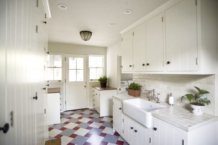 White kitchen with colored flooring