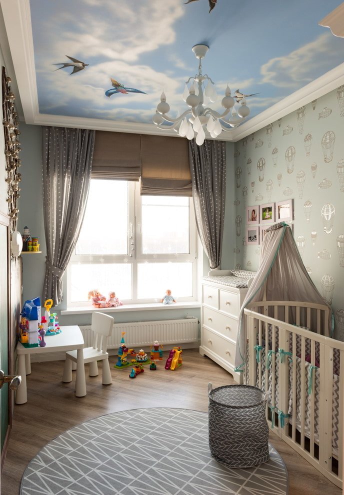 stretch ceiling with a chandelier in the nursery