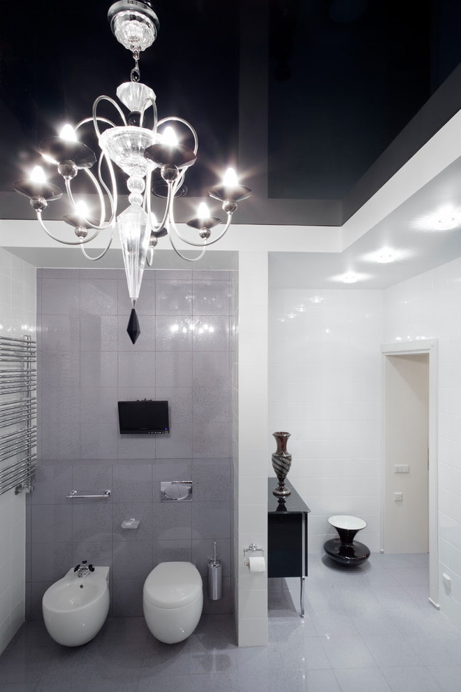stretch ceiling with a chandelier in the bathroom