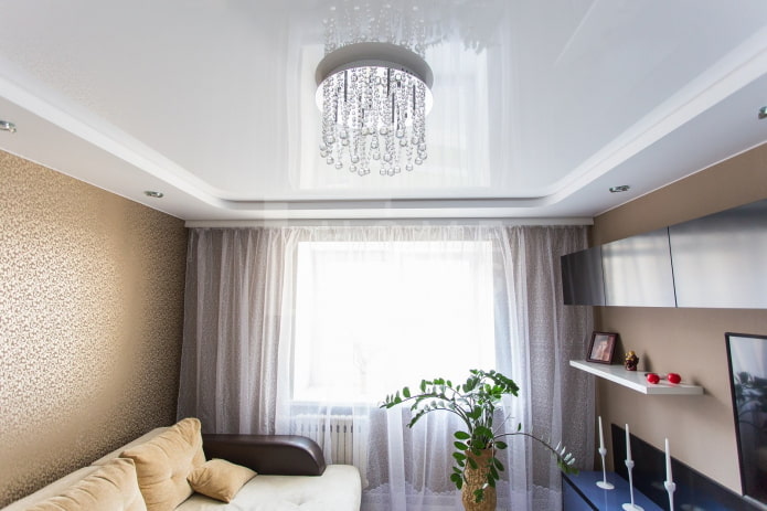 stretch ceiling with a chandelier in the interior
