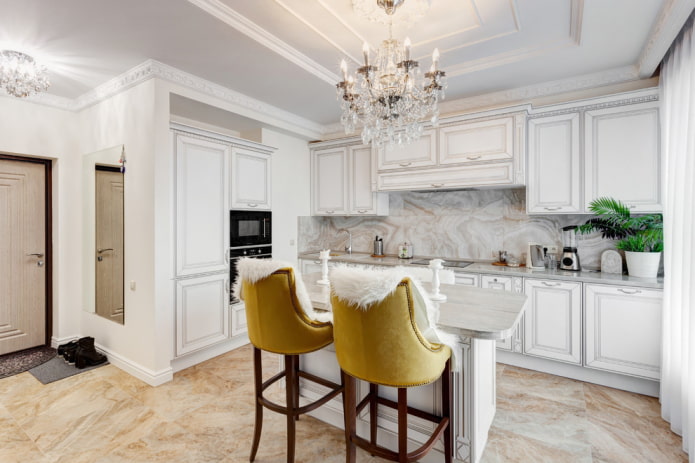 chandelier over the island in the kitchen interior