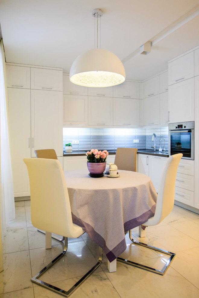 chandelier on the ceiling in the kitchen interior